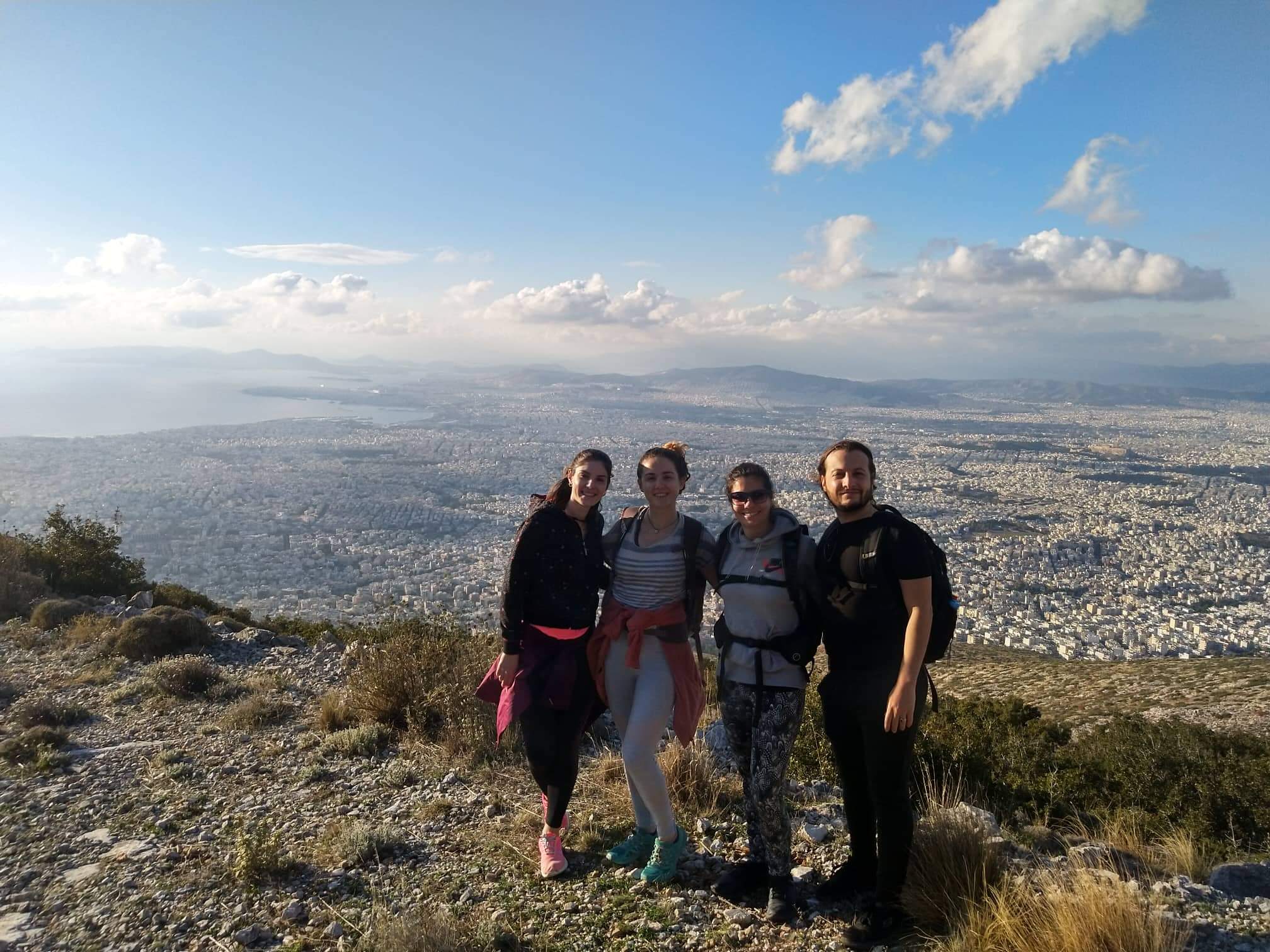A photo after Greek traditional dance lesson in Attica with Athens view